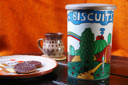 vintage Crown Devon pottery biscuit barrel with plate of biscuits and handmade pottery mug