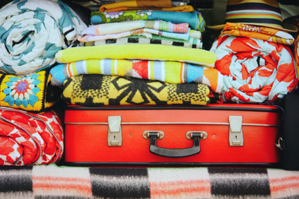 page in My Cool Campervan featuring a campervan boot full of colourful luggage and bedding