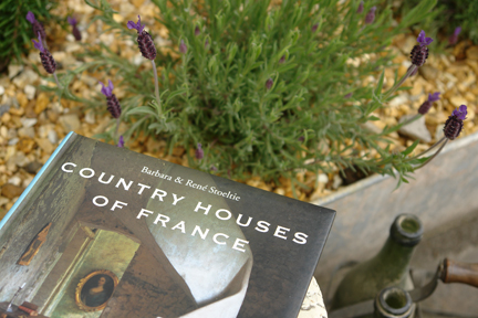 "Country Houses of France" book by René & Barbara Stoeltie photographed with galvanised tub of lavender and shabby chic bottles