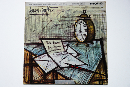 Ella Fitzgerald LP cover of a table with alarm clock, paper, envelope and pen illustrated by Bernard Buffet