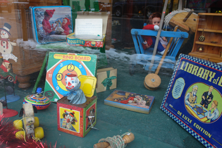 vintage toys and games in Christmas decorated shop window in Picture House Antiques in Todmorden