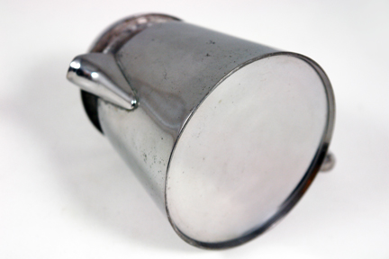 detail from vintage industrial designed steel coffee percolator detail from vintage industrial designed steel coffee percolator