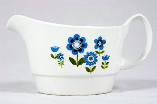 vintage gravy boat decorated with simple flower motif