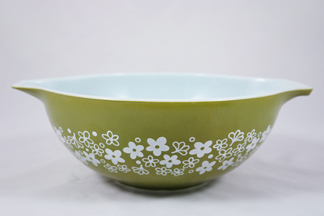 vintage Pyrex bowl decorated with green flower motif