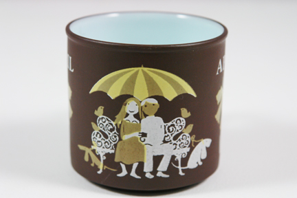 detail from a vintage "April" mug produced by Hornsea Pottery showing sweethearts on a park bench detail from a vintage "April" mug produced by Hornsea Pottery showing sweethearts on a park bench
