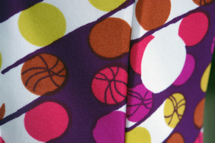 detail of fabric from vintage 1960s/70s sleeveless patterned polyester dress