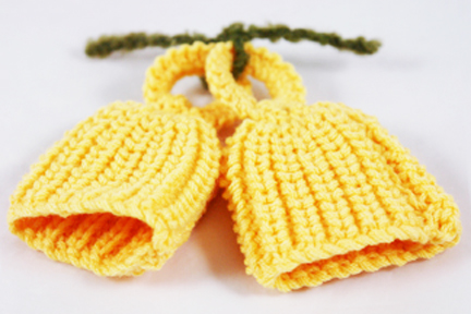 pair of yellow handknitted egg cosies pair of yellow handknitted egg cosies