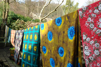 collection of vintage 1950s fabric hanging on a washing line collection of vintage 1950s fabric hanging on a washing line