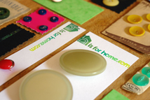 sewing vintage buttons on to card in preparation for H is for Home's 1st vintage fair