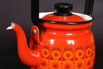detailed view of a red, vintage Finel enamel kettle