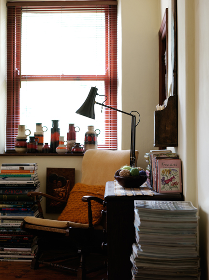 Bookshelf and armchair in H is for Home's master bedroom