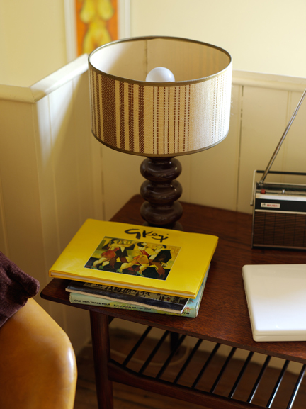 Books on a table in H is for Home's den