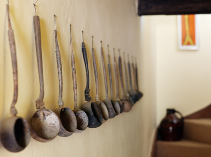vintage bamboo ladels in the hallway leading up to the den on the top floor of H is for Home's house