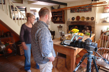 Photographer, Simon Whitmore and stylist, Sally Denning in our kitchen discussing photos