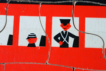 detail of vintage children's jigsaw of a red London double decker bus