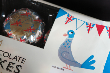 detail from Marks and Spencer chocolate teacake packaging decorated with illustrations of birds and bunting
