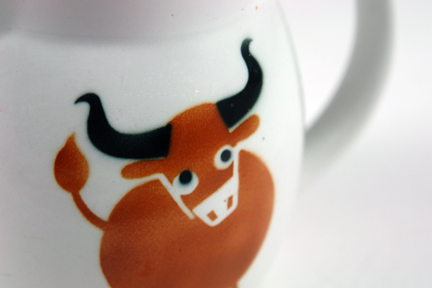 detail from a vintage Arabia milk jug with cow design