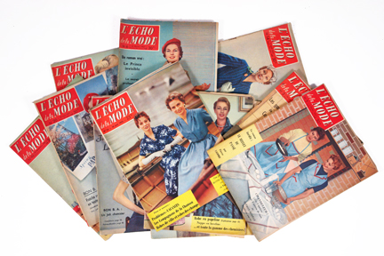 pile of vintage 1950s French "L'Echo de la Mode" magazines pile of vintage 1950s French "L'Echo de la Mode" magazines
