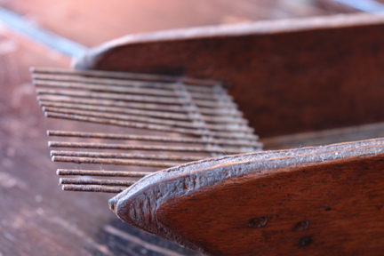 detail of mystery object on pine topped table