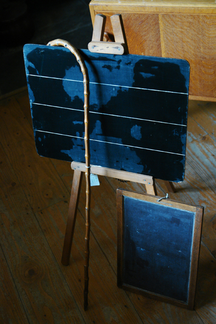 vintage writing slate, blackboard on an easel, and bamboo walking cane vintage writing slate, blackboard on an easel, and bamboo walking cane