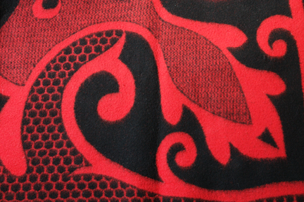 detailed view of red vintage woollen blanket