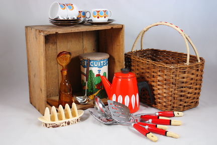 selection of recently acquired vintage shop stock for H is for Home including a red orange & white Cathrineholm Lotus enamel kettle, selection of Skyline kitchen utensils, wicker basket and Sylvac Pottery toast rack