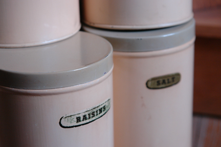 detail from a set of 1950s cream coloured kitchen storage tins