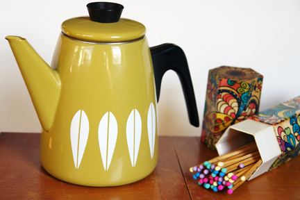 vintage olive green Cathrineholm teapot and fire lighting matches with colourful tips in original hexagonal shaped, cardboard box