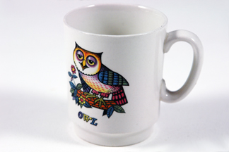 vintage white pottery mug with transfer printed owl figure