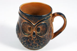 vintage pottery mug with owl face in relief on the side