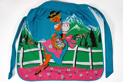 vintage pinny with Alpine scene with pretty blonde lady and snow-topped mountain in the background vintage pinny with Alpine scene with pretty blonde lady and snow-topped mountain in the background