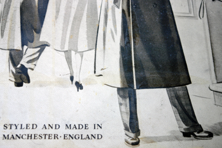 detail from a  vintage shop advertising sign for Antirain Rainwear