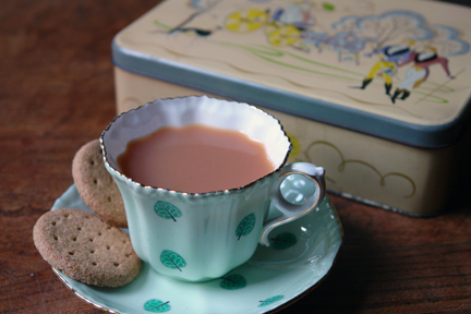 vintage biscuit tin produced by A Romary and Company Limited decorated with Regency period figures of dandies promenading and ladies in a horse drawn carriage and a cup & saucer produced by Royal Grafton vintage biscuit tin produced by A Romary and Company Limited decorated with Regency period figures of dandies promenading and ladies in a horse drawn carriage and a cup & saucer produced by Royal Grafton