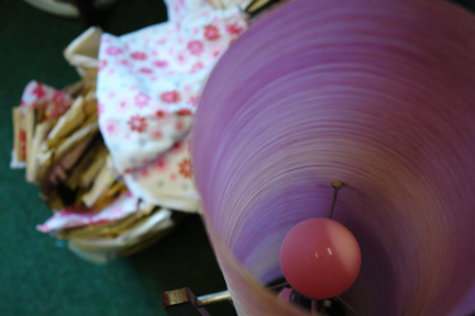 detailed view of a lavender coloured vintage rocket lamp showing its pink bulb