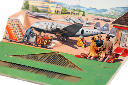 vintage 1950s book of sewing needles illustrated with an airfield, planes and travellers