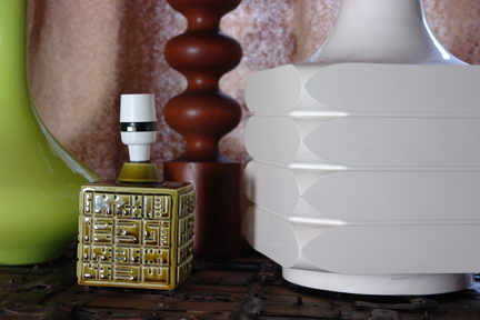 collection of vintage lamps including a pair of olive green Poole Pottery cubes, one tall, teak Danish example and a lime green glass pear shaped base collection of vintage lamps including a pair of olive green Poole Pottery cubes, one tall, teak Danish example and a lime green glass pear shaped base