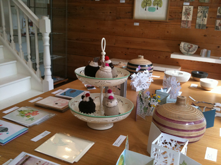 tabletop display of various art & craft items available at Snug Gallery in Hebden Bridge