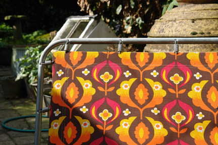 Detail of vintage sun lounger with floral fabric