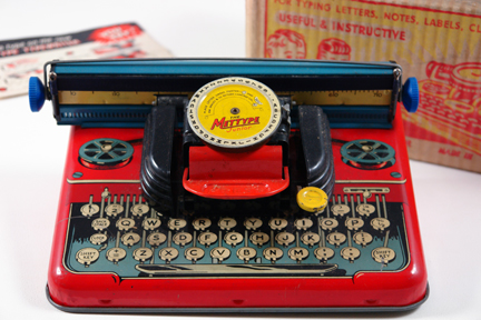 vintage 1950s red tin Mettype typewriter vintage 1950s red tin Mettype typewriter