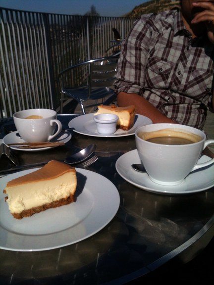 slices of cheesecake & cups of coffee on the terrace of the Holmfirth Vineyard restaurant