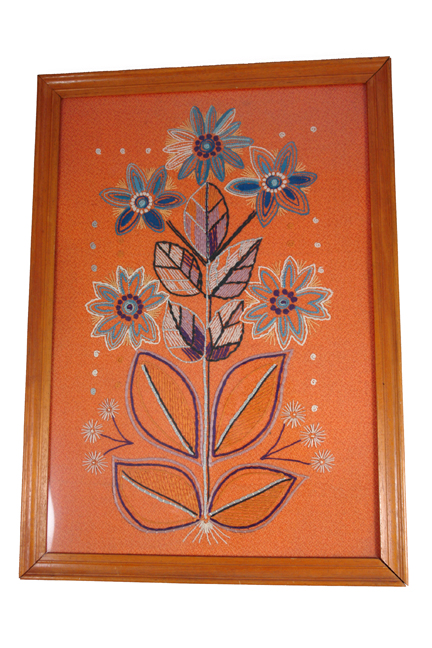 framed & glazed vintage wool work in shades of orange featuring a bouquet of flowers framed & glazed vintage wool work in shades of orange featuring a bouquet of flowers